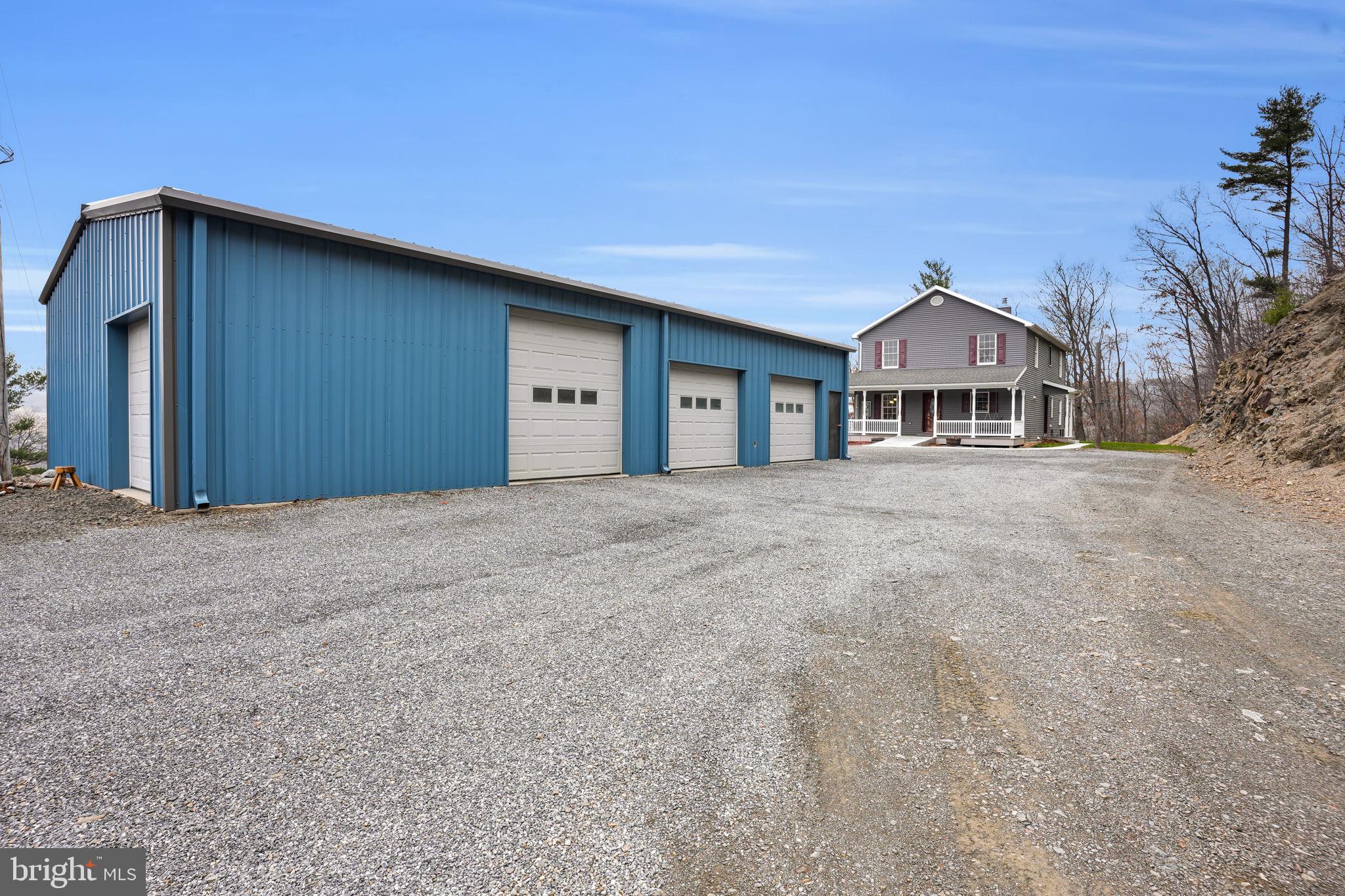 7848 Rte 104 Mount Pleasant Mills, PA 17853 - Photo 40 of 54 a front view of a house with a big yard