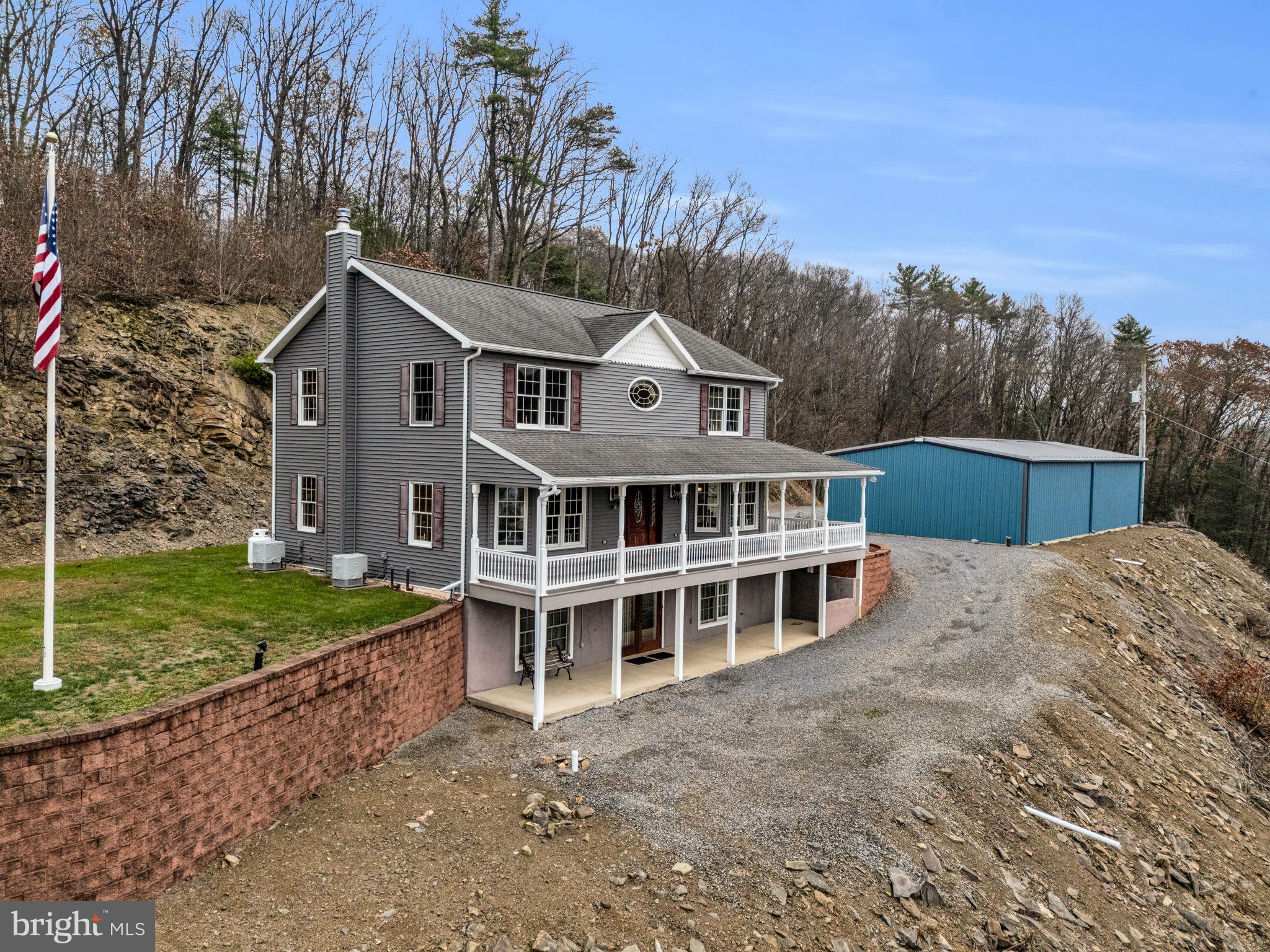7848 Rte 104 Mount Pleasant Mills, PA 17853 - Photo 4 of 54 a front view of a house with a yard