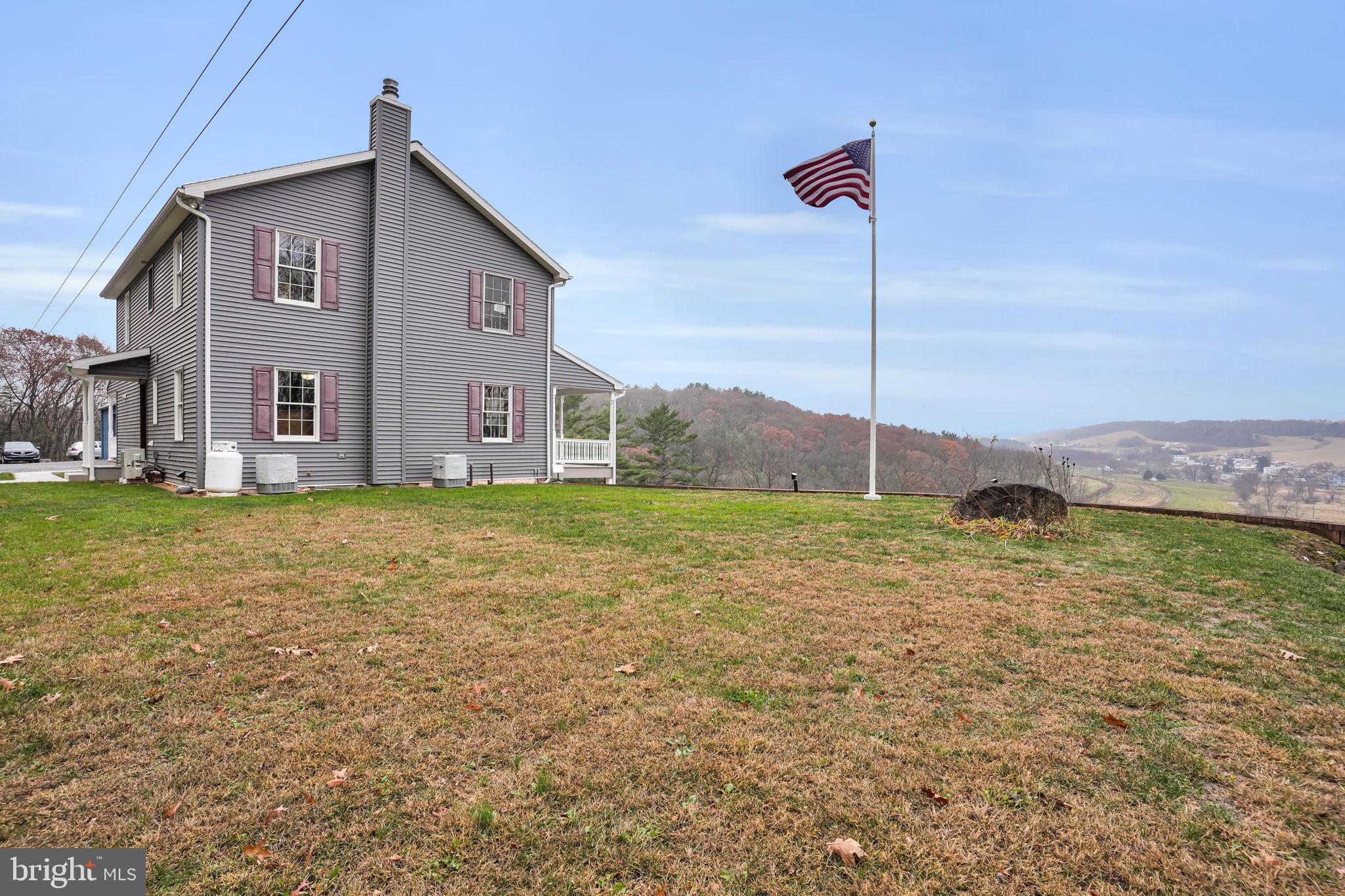 7848 Rte 104 Mount Pleasant Mills, PA 17853 - Photo 43 of 54 a front view of a house with a yard