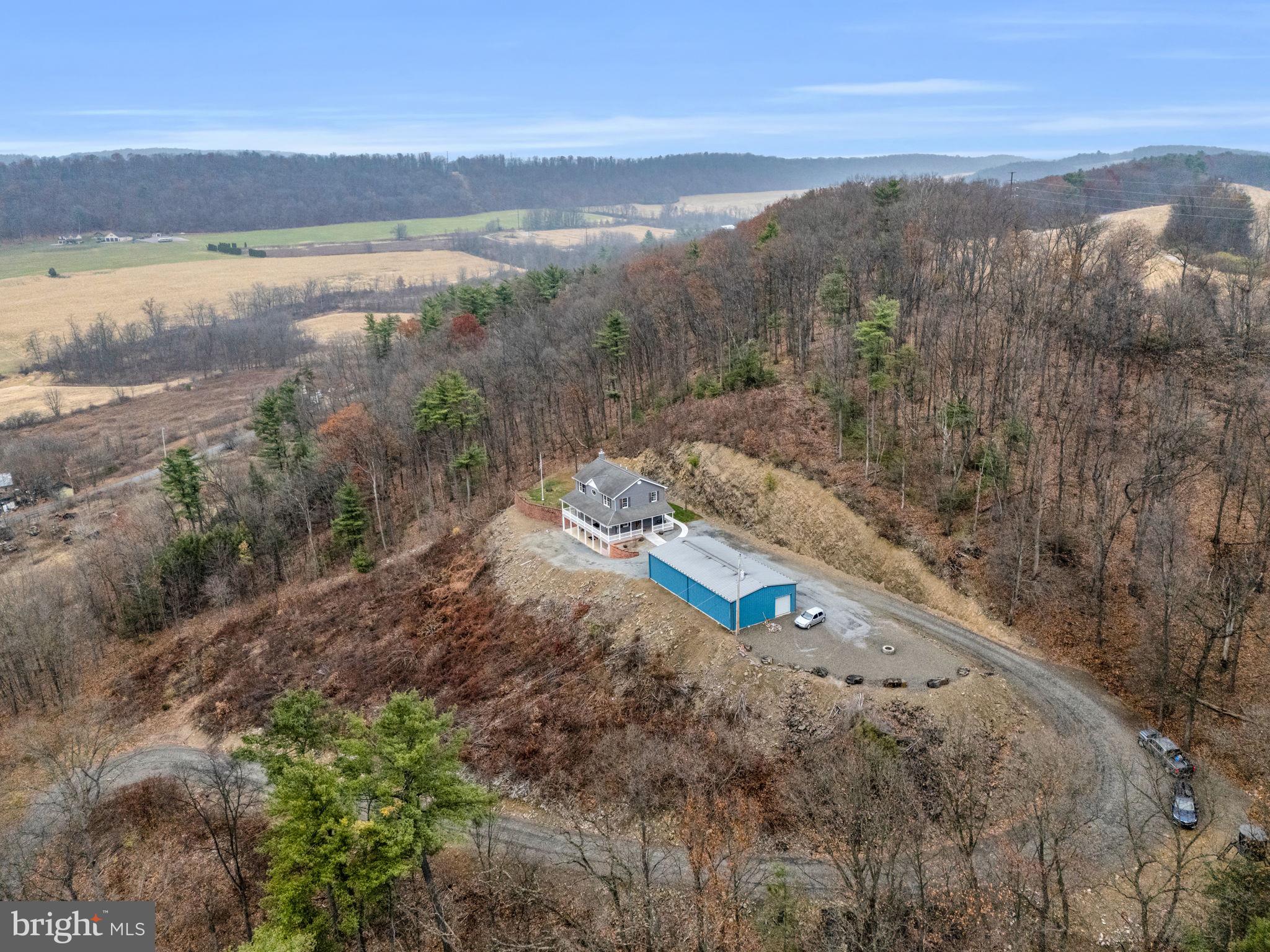 7848 Rte 104 Mount Pleasant Mills, PA 17853 - Photo 48 of 54 a view of a lake with a mountain