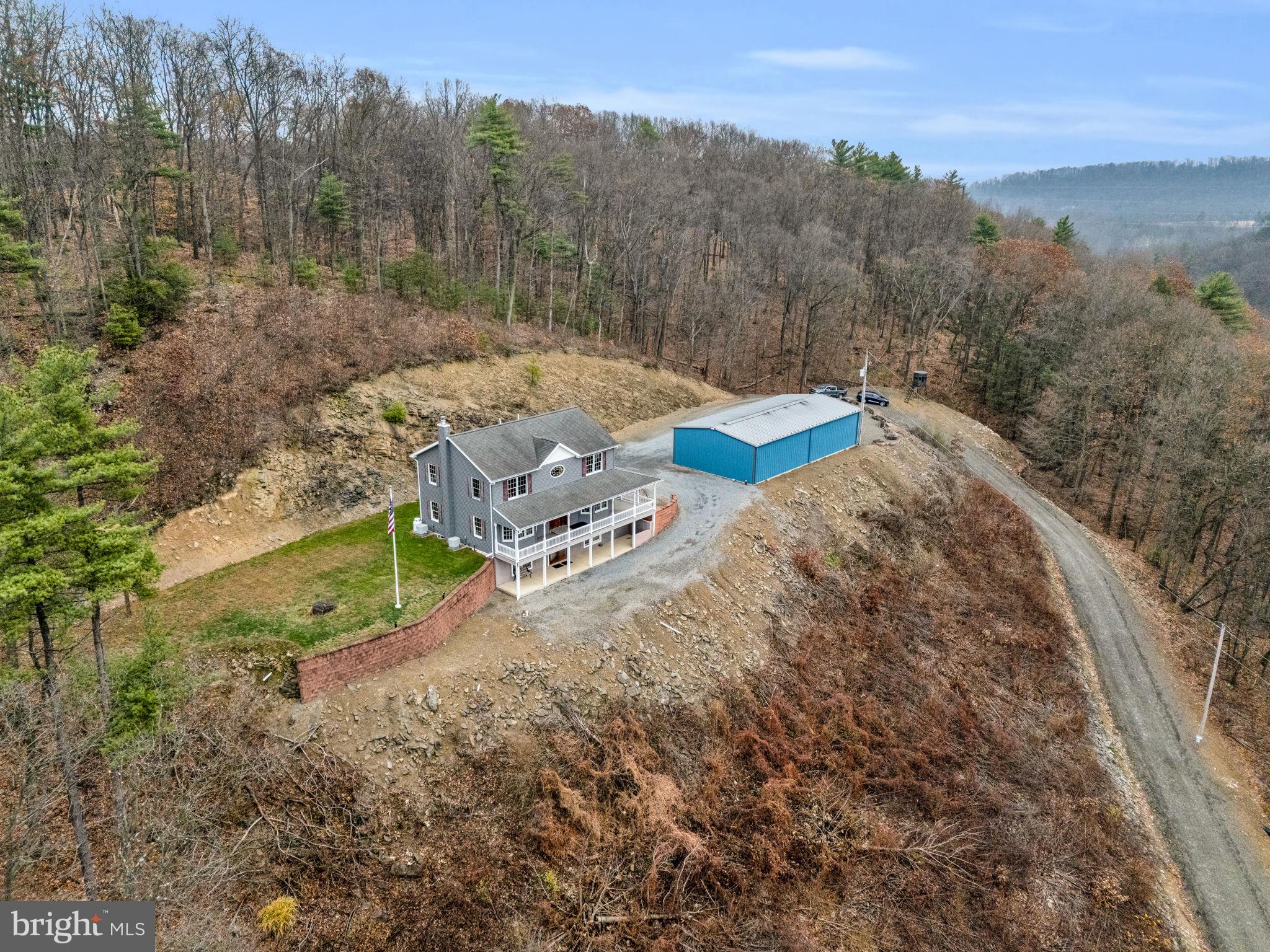 7848 Rte 104 Mount Pleasant Mills, PA 17853 - Photo 52 of 54 a view of a house with a yard