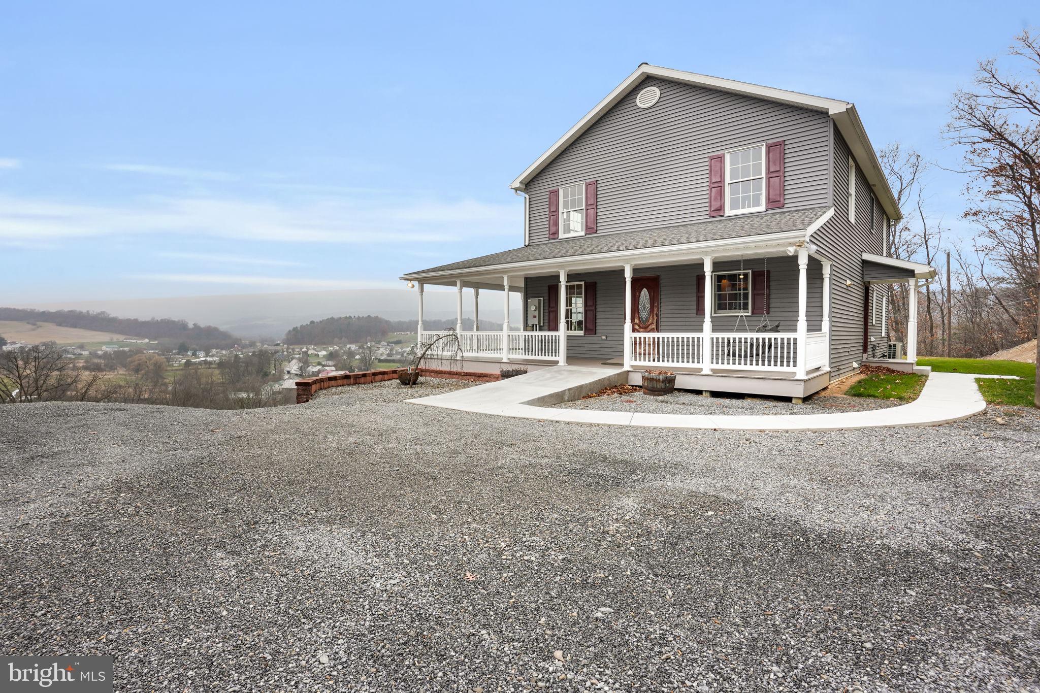 7848 Rte 104 Mount Pleasant Mills, PA 17853 - Photo 9 of 54 a front view of a house with a yard