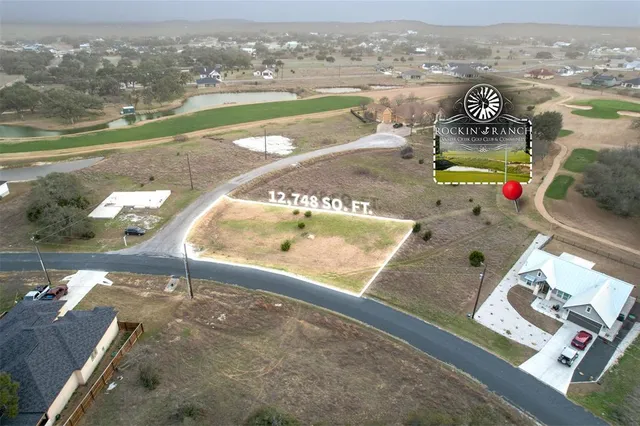 swimming pool view with a lake view