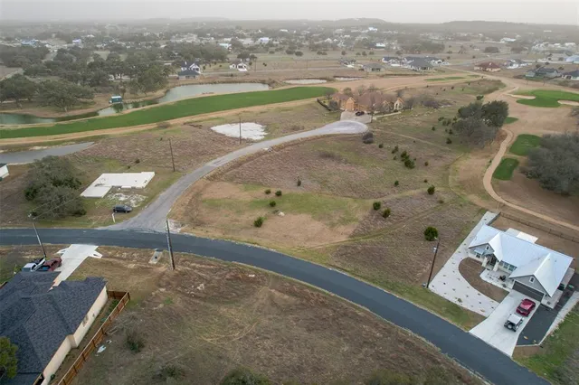 a view of a lake with houses in the back
