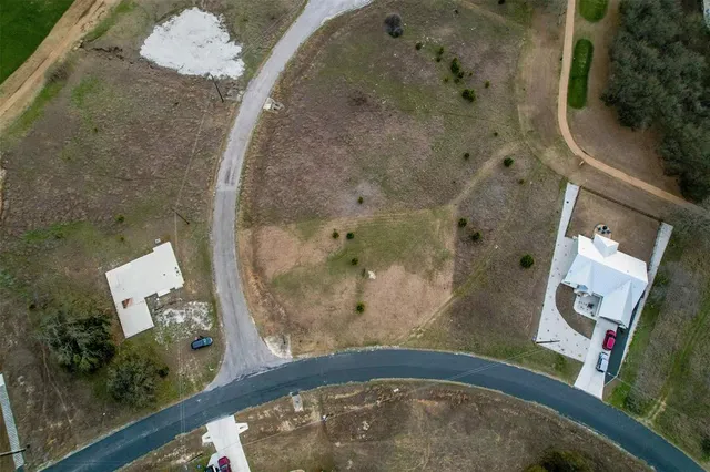 a view of a lake with houses in background