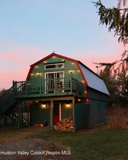 a view of a town with mountains in the background