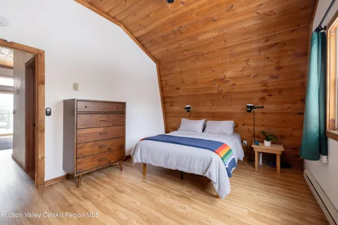 a bedroom with a bed and a closet