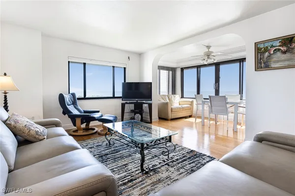 a living room with furniture or couch and a wooden floor