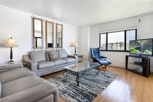 a living room with furniture or couch and a window