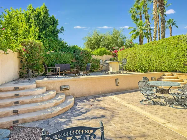 a view of a swimming pool with a patio