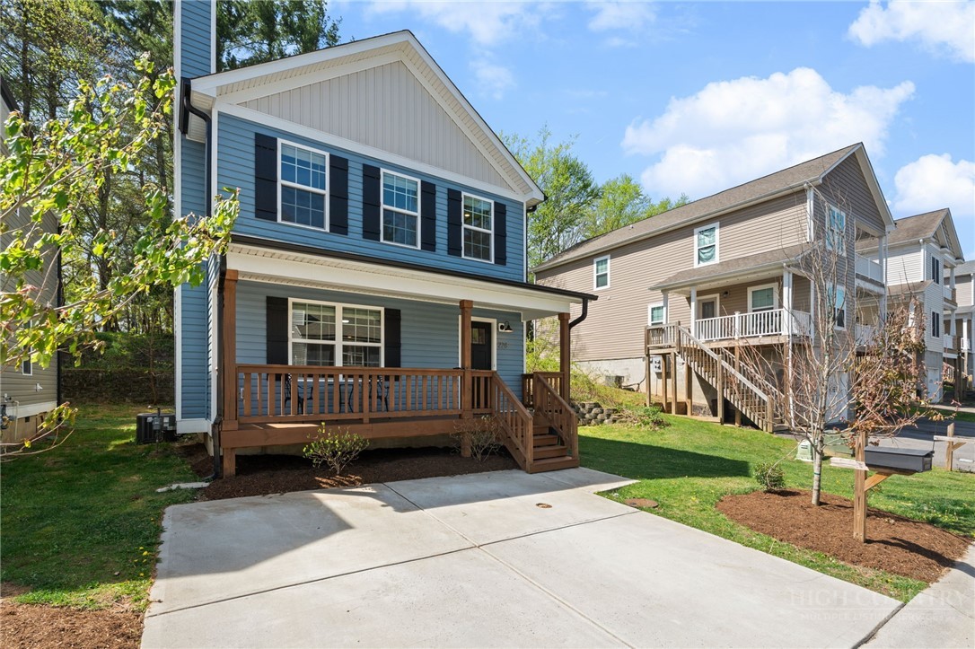 228 Stratford Lane Boone, NC 28607 - Photo 2 of 33 a front view of a house with a yard