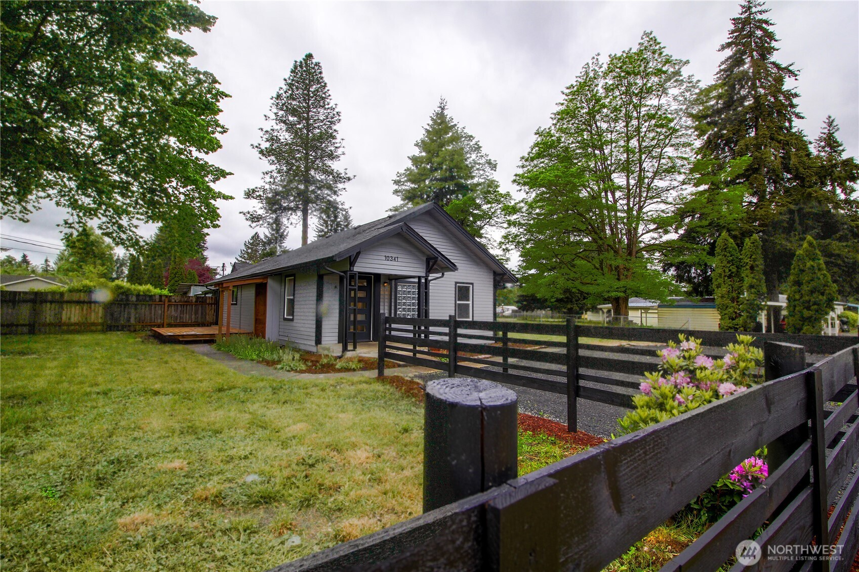 10341 184th Avenue Southwest Rochester, WA 98579 - Photo 21 of 36 a front view of a house with yard and trees