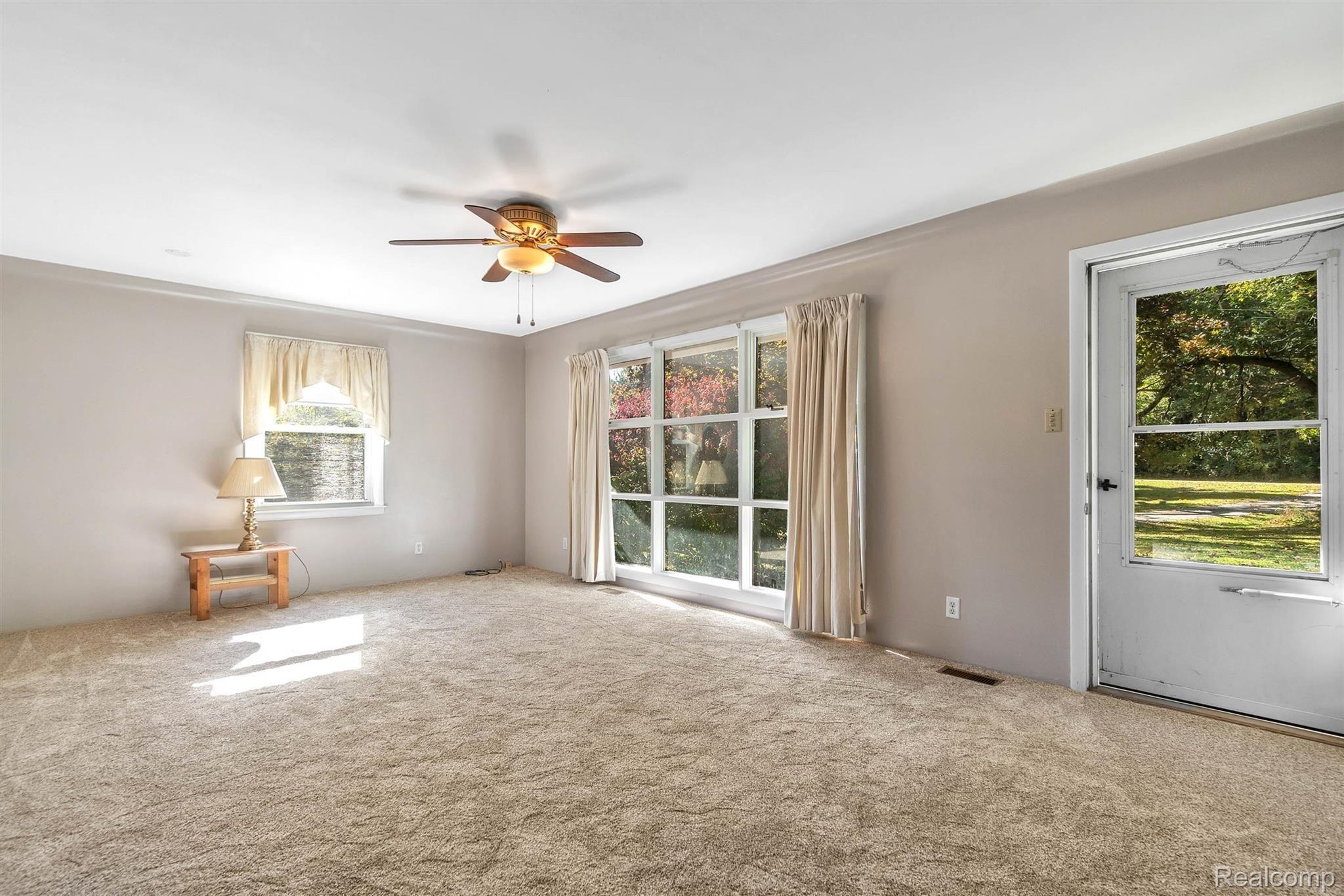 3200 Sexton Road Howell, MI 48843 - Photo 7 of 35 Tons of natural light in living room with new carpeting