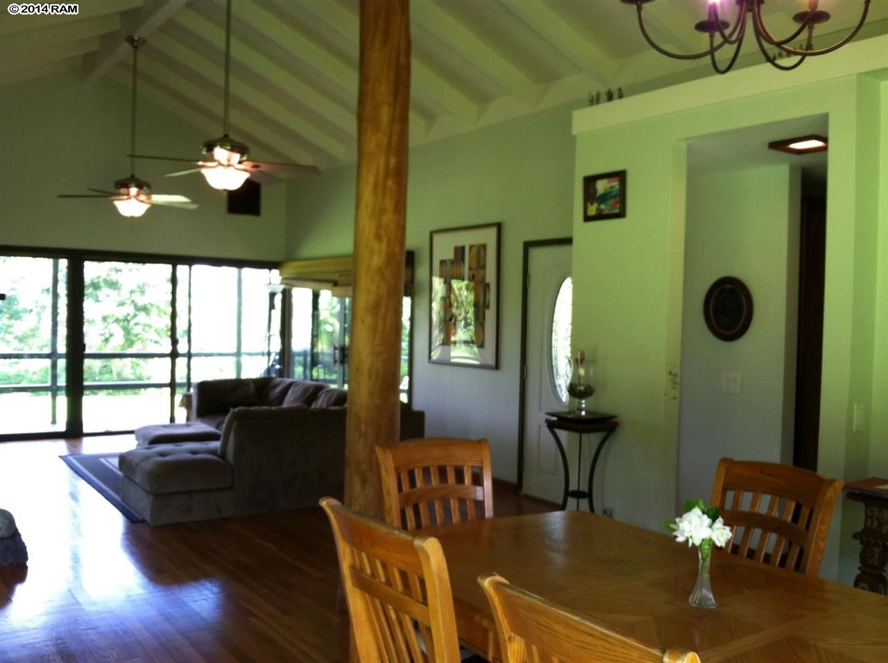 60 Kalo Road, Unit 19 Hana, HI 96713 - Photo 6 of 30 a living room with furniture and a chandelier