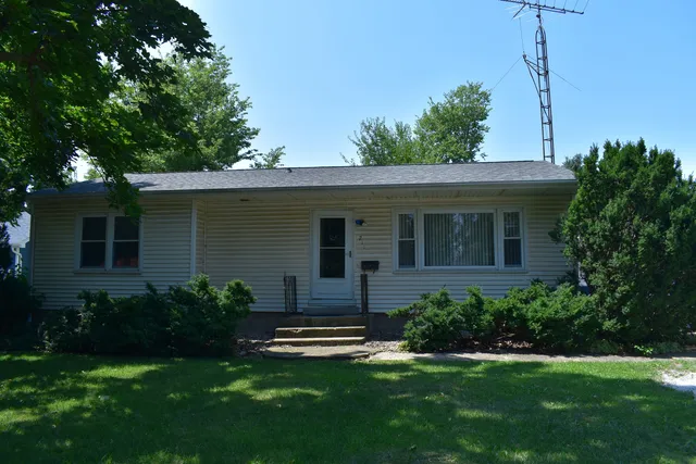 a view of a house with a yard porch and a garden