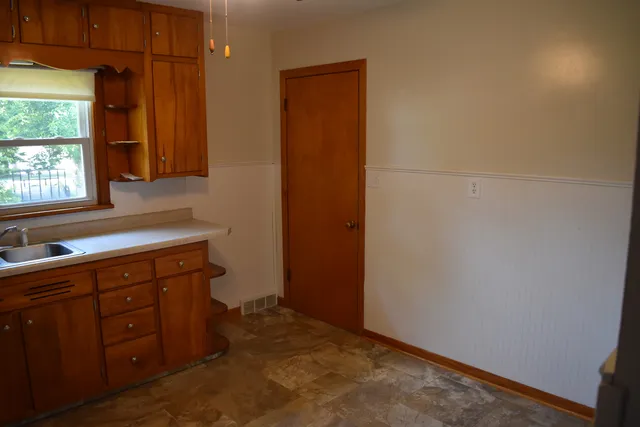 a room with a sink and a window