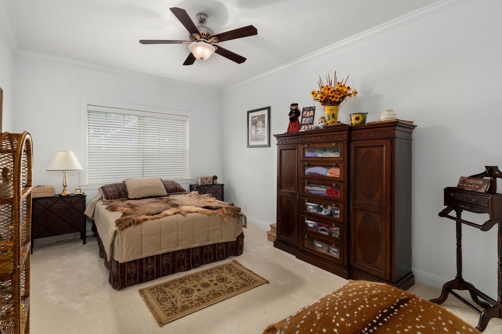 608 Bohlmann Avenue Schulenburg, TX 78956 - Photo 26 of 48 a bedroom with a bed and cabinets