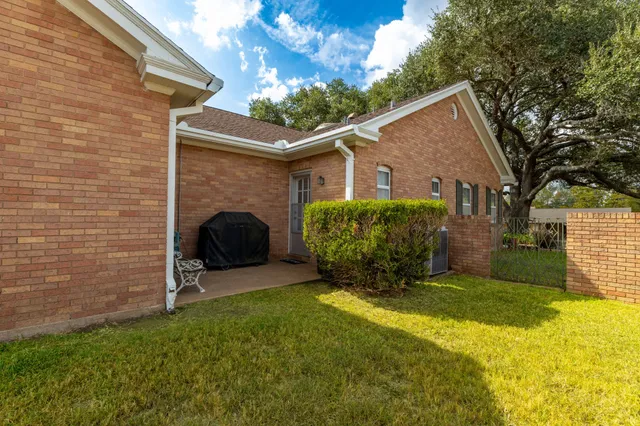 a view of a park with large trees