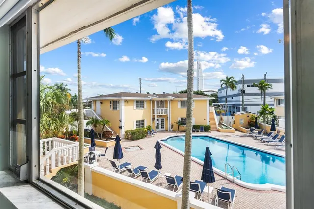 a view of living room with balcony and furniture