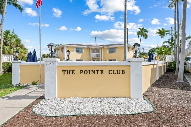 a sign that is on a brick building