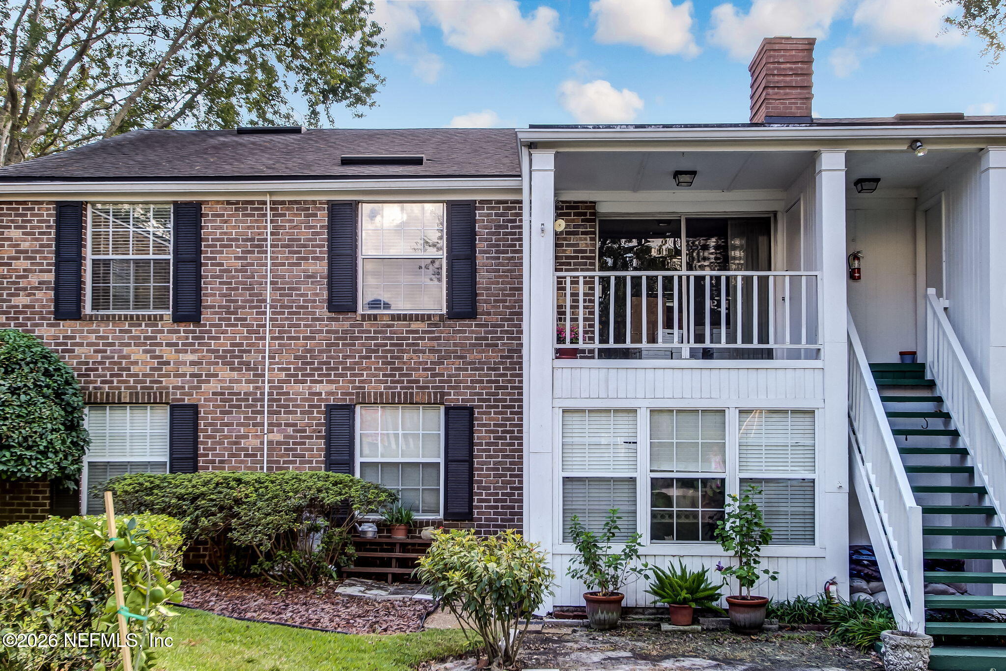 4358 Timuquana Road, Unit 134 Jacksonville, FL 32210 - Photo 22 of 31 front view of a brick house with a large windows