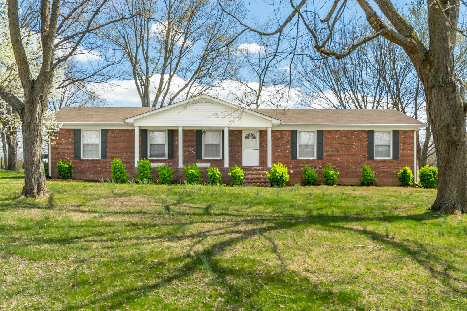 1462 New Deal Potts Road Portland, TN 37148 - Photo 3 of 29 a front view of a house with a yard and trees