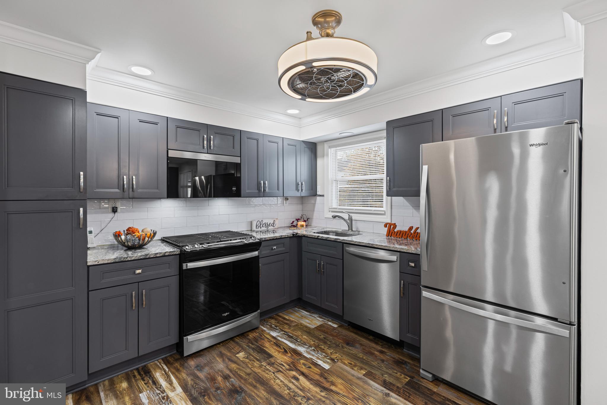20 Summer Avenue Burlington, NJ 08016 - Photo 12 of 30 a kitchen with stainless steel appliances granite countertop a refrigerator a stove a sink and a microwave