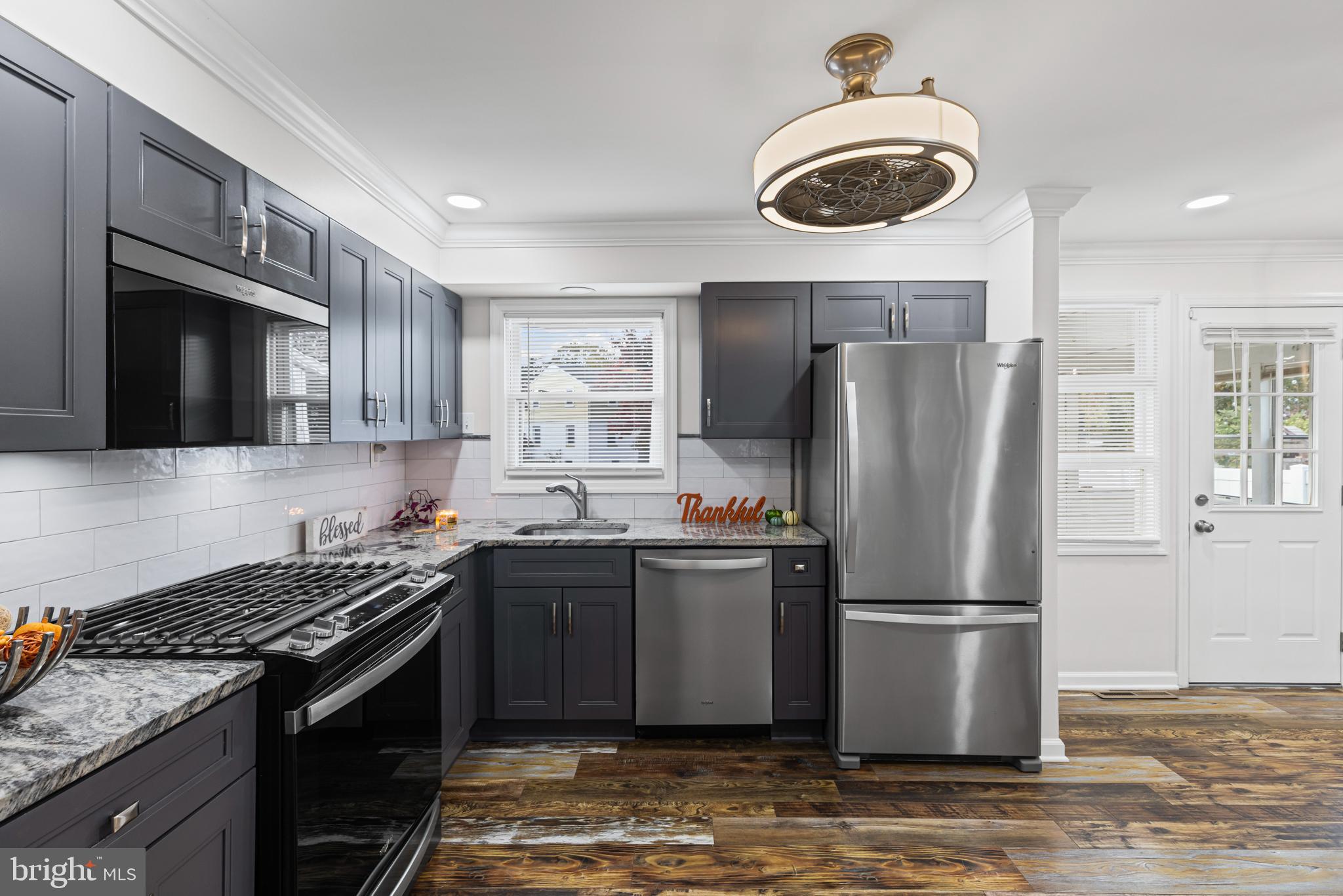 20 Summer Avenue Burlington, NJ 08016 - Photo 13 of 30 a kitchen with stainless steel appliances granite countertop a stove a refrigerator and a microwave