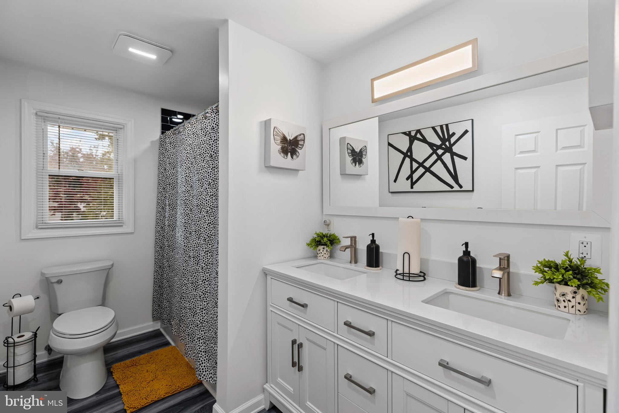 20 Summer Avenue Burlington, NJ 08016 - Photo 19 of 30 a bathroom with a toilet a sink and a mirror