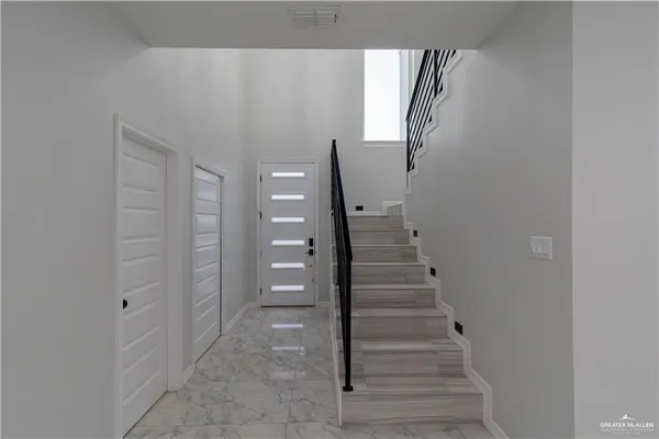 a view of an entryway with staircase