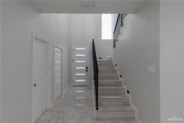 a view of an entryway with staircase