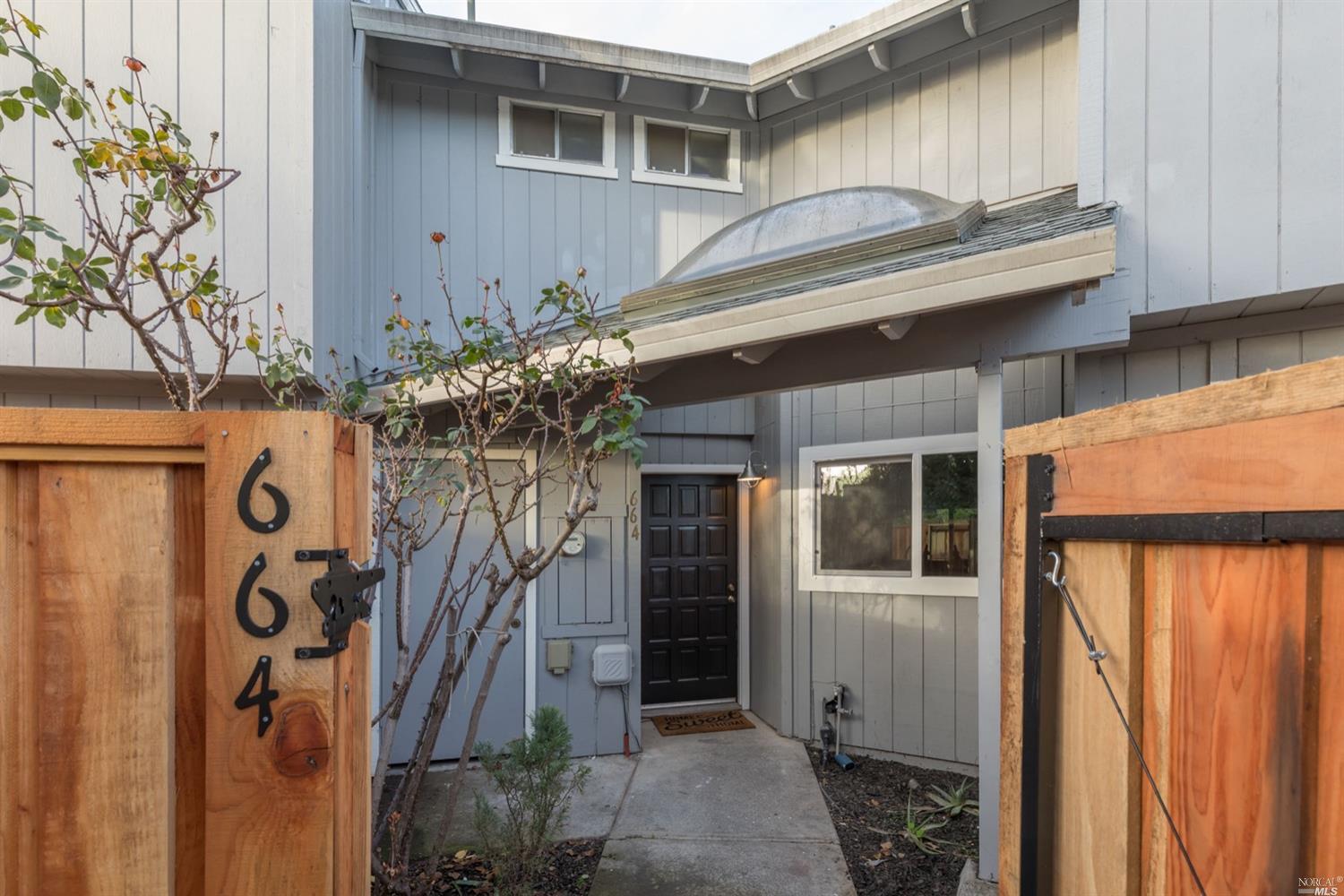 664 Racquet Club Circle Rohnert Park, CA 94928 - Photo 1 of 1 a view of a house with a door and wooden walls
