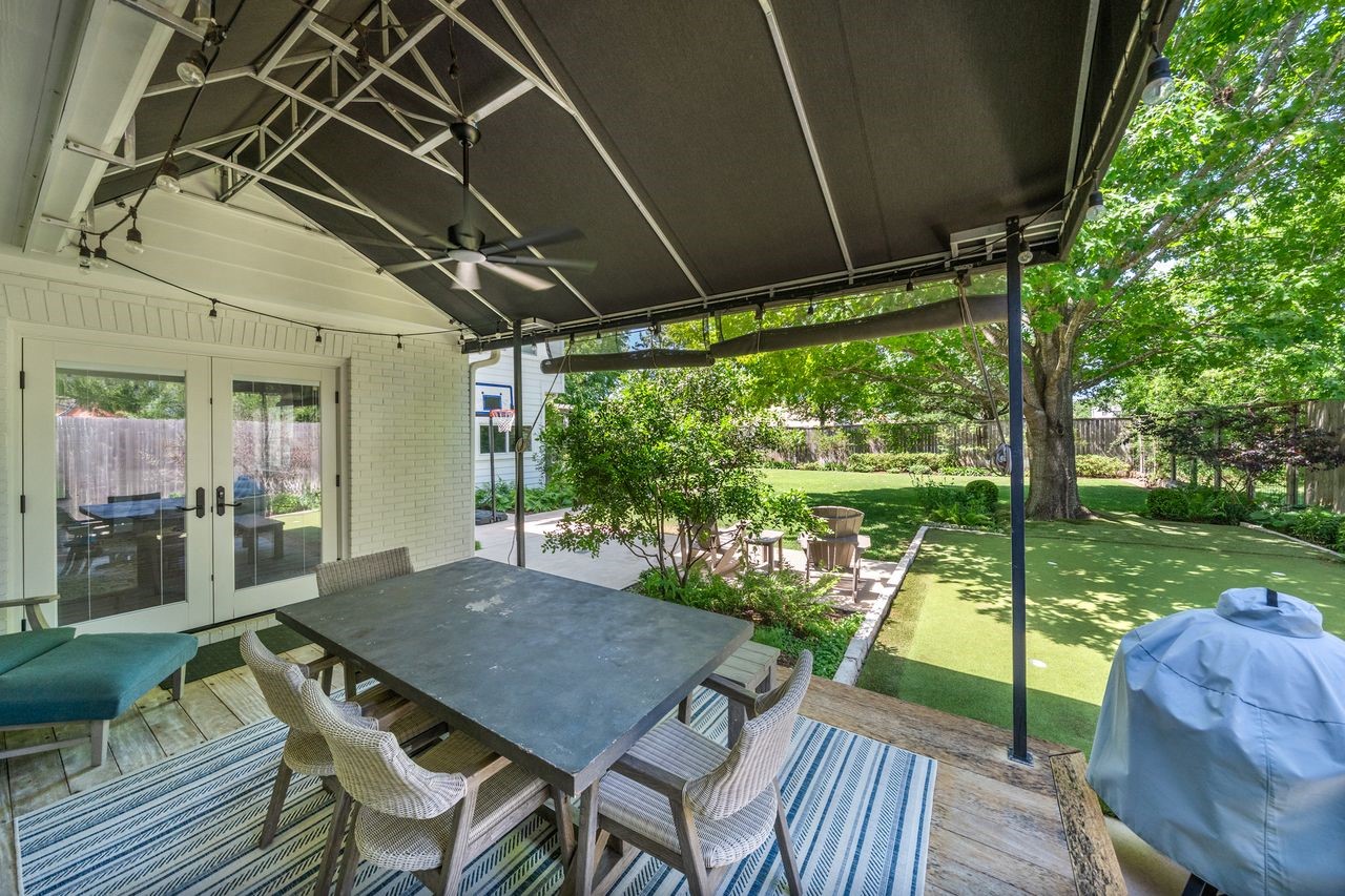 6510 Community Drive Houston, TX 77005 - Photo 4 of 37 Step outside and explore a backyard designed for living. The covered deck enhances your living space throughout the year, making it ideal for weekend barbecues and birthday parties.