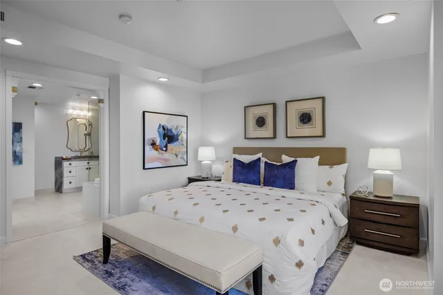 a bedroom with a bed and a lamp