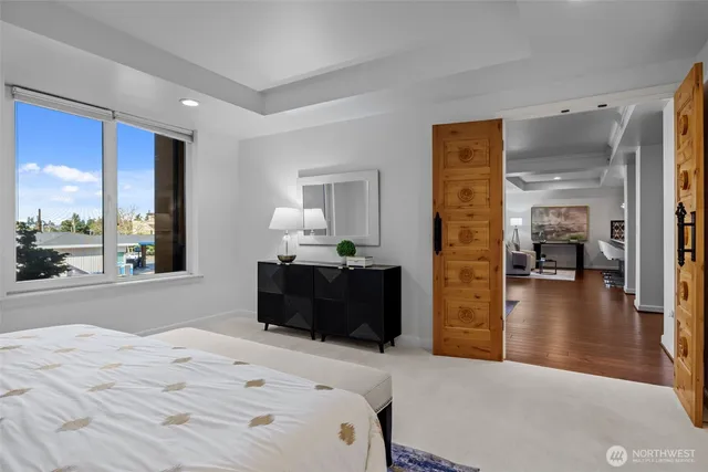 a bedroom with a bed and a dresser