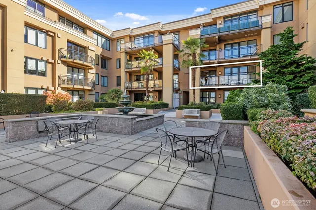 a view of a patio with a table and chairs