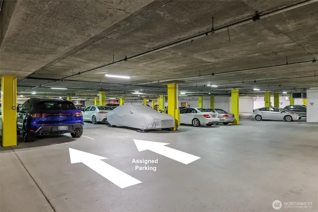 a view of a hallway with a livingroom and a bathroom with sink