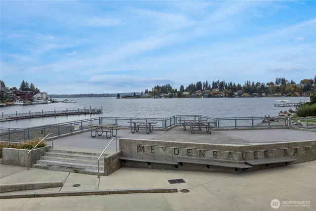 a view of a swimming pool with outdoor seating
