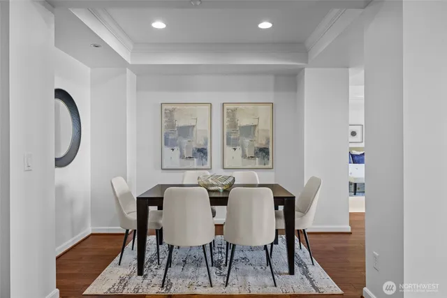 a view of a dining room with furniture and wooden floor