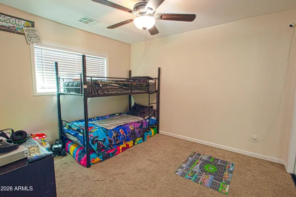 a room with a bed and a mirror