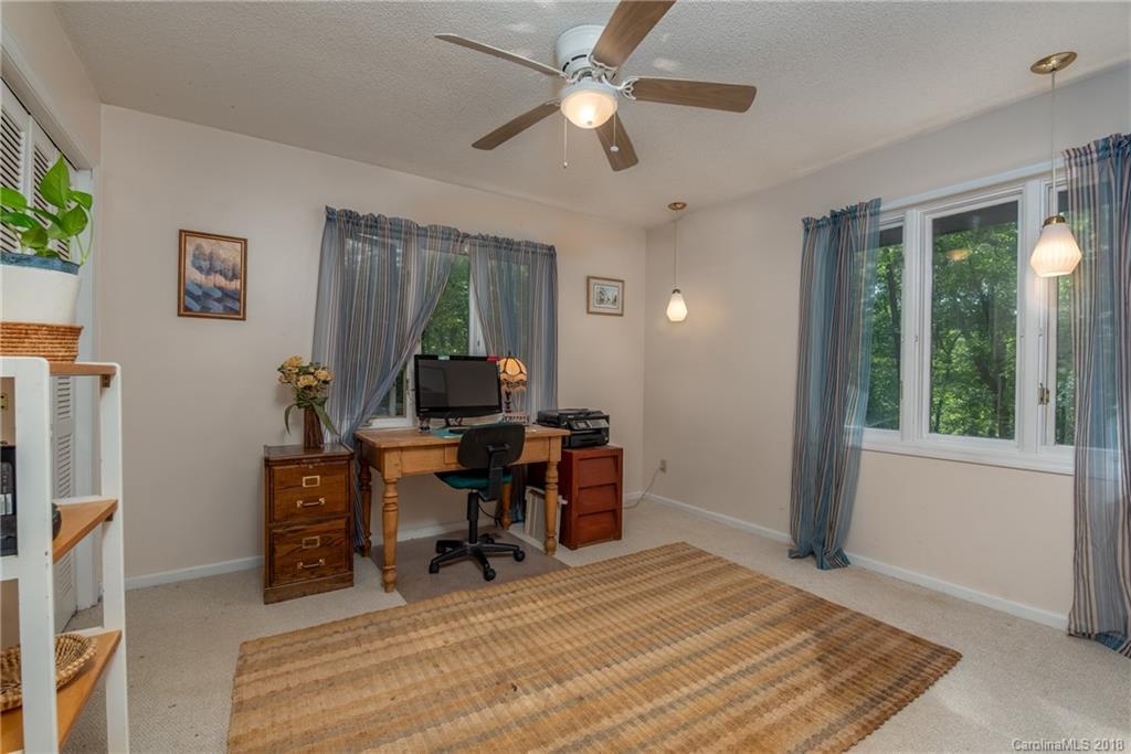 1235 Braewick Road Tryon, NC 28782 - Photo 14 of 22 a view of a workspace with furniture and a window
