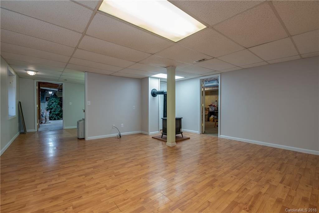 1235 Braewick Road Tryon, NC 28782 - Photo 19 of 22 a view of an empty room with glass door