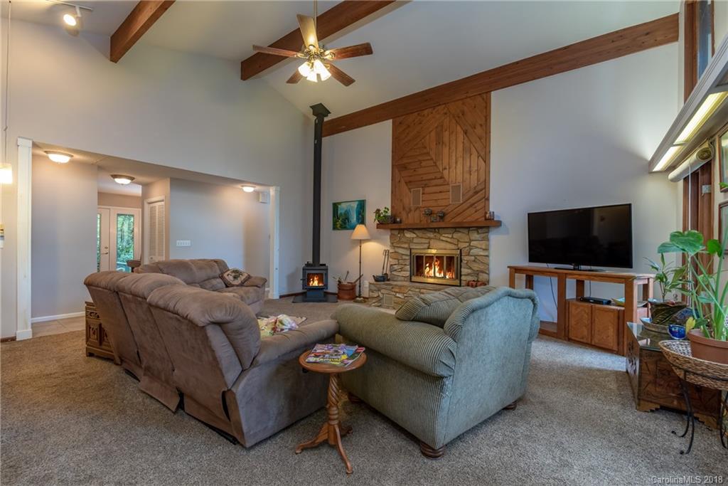 1235 Braewick Road Tryon, NC 28782 - Photo 4 of 22 a living room with furniture and a flat screen tv