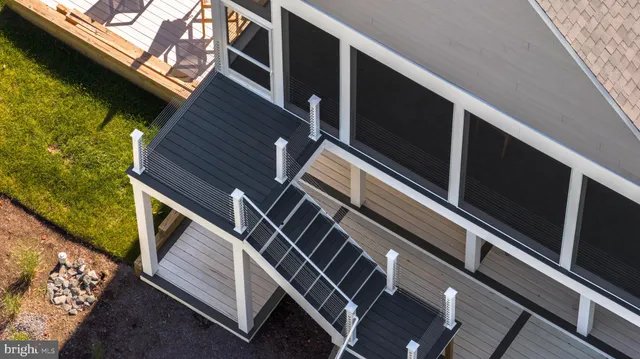 a view of a two chairs in the balcony