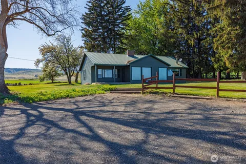 a house with trees in the background