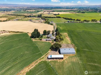 a view of a swimming pool and a yard