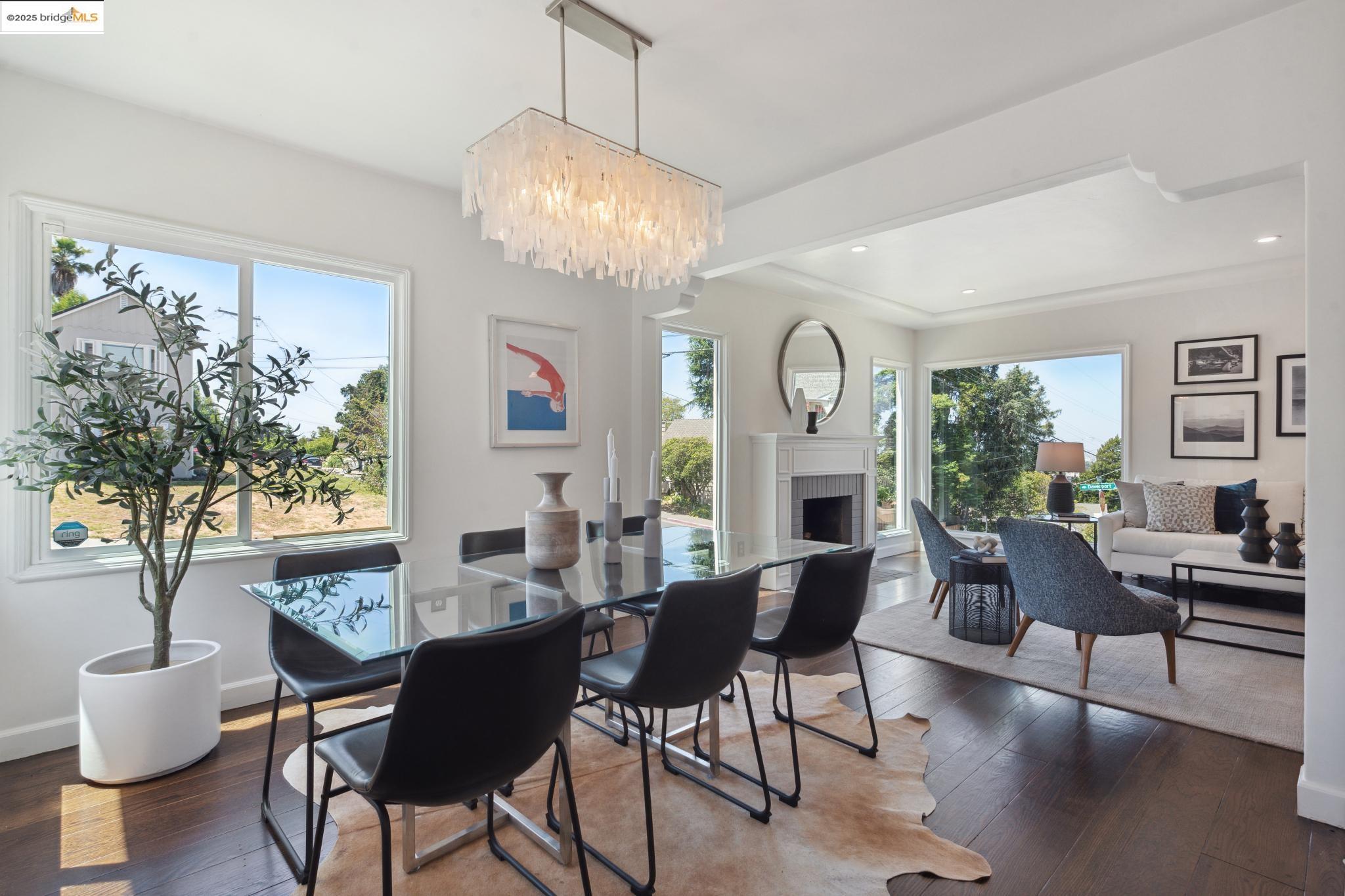 Undisclosed Address Oakland, CA 94619 - Photo 11 of 60 a view of a dining room with furniture window and wooden floor