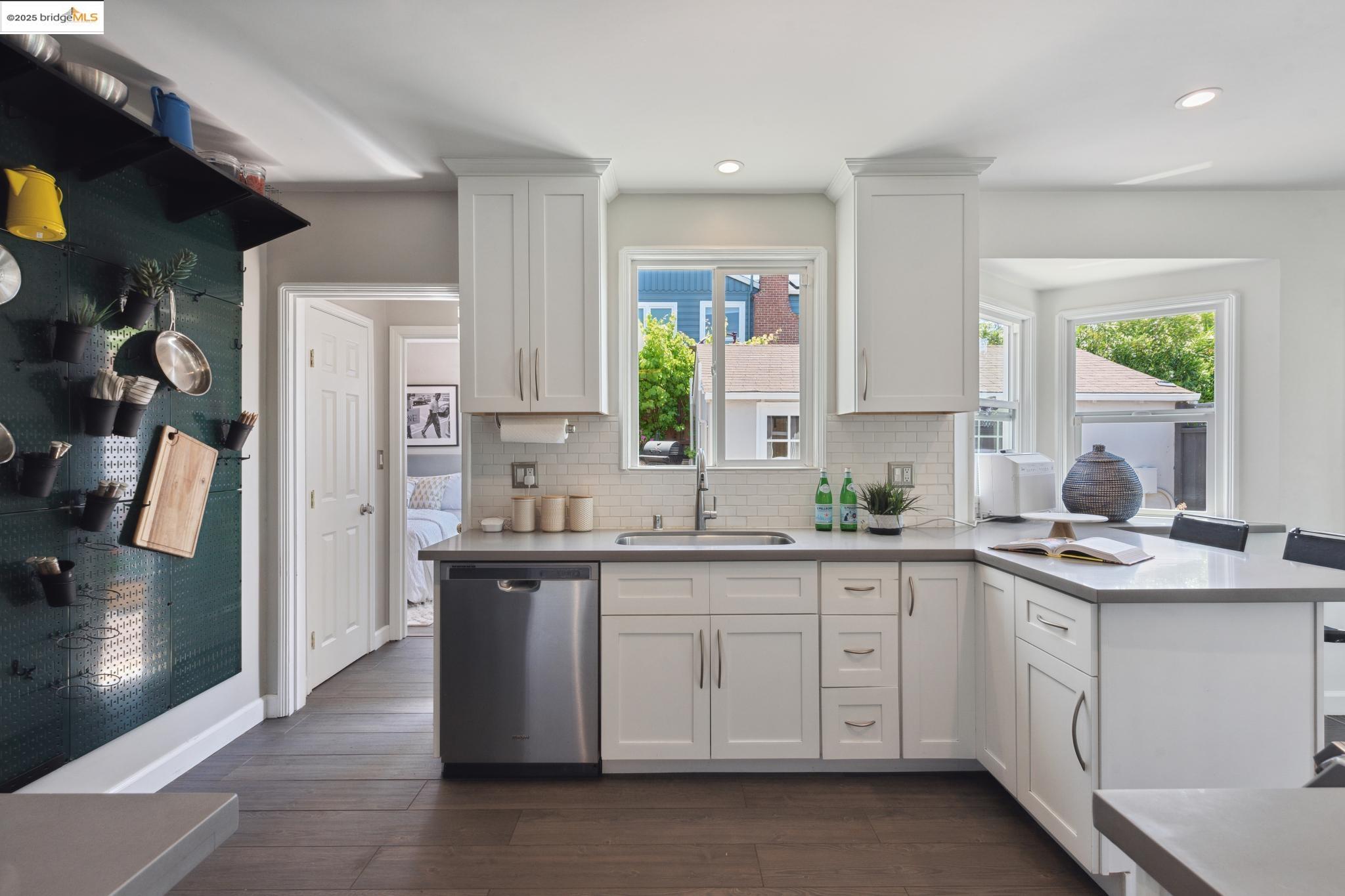 Undisclosed Address Oakland, CA 94619 - Photo 17 of 60 a kitchen with a sink stove and refrigerator