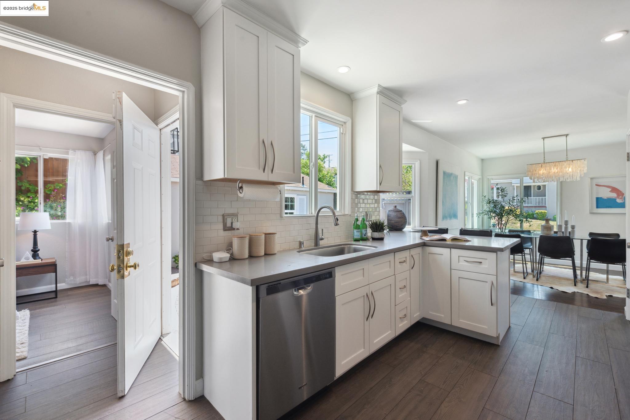 Undisclosed Address Oakland, CA 94619 - Photo 18 of 60 a kitchen with white cabinets and sink