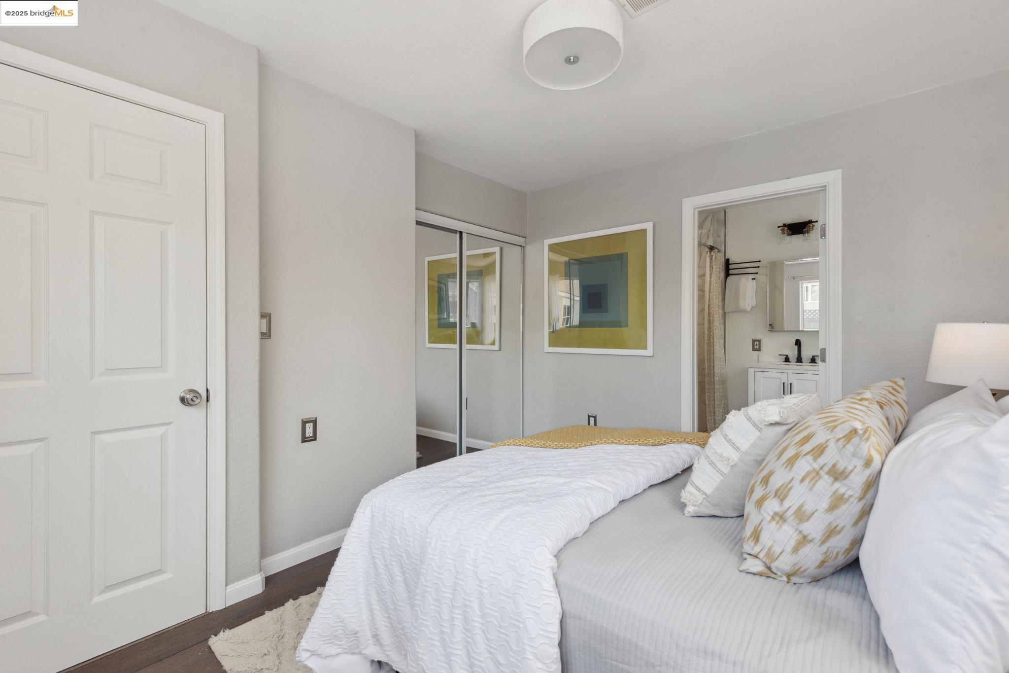 Undisclosed Address Oakland, CA 94619 - Photo 21 of 60 a bedroom with a bed and a mirror